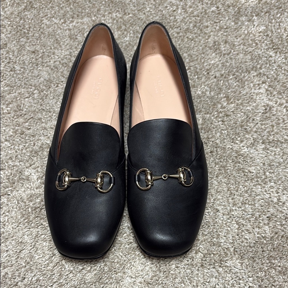 Black Woman’s Gucci Loafers with Champagne Gold Detailing